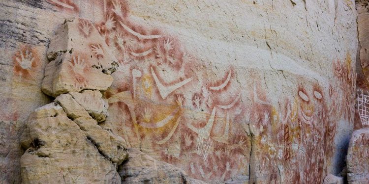 Aboriginal drawings on a rock wall.