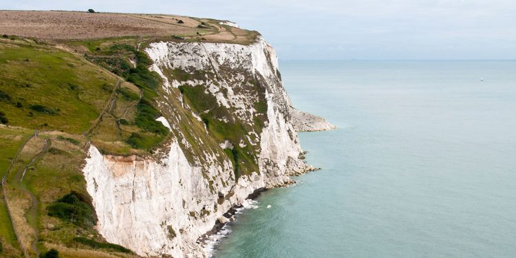 white cliffs of Dover overlook a calm sea