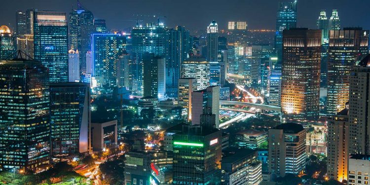 A night shot of Jakarta's downtown cityscape.