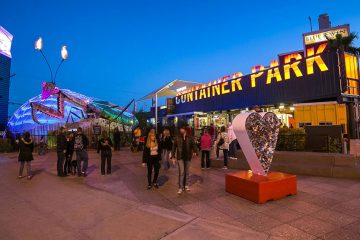 A people walking to and from the entrance of Container Park in Las Vegas