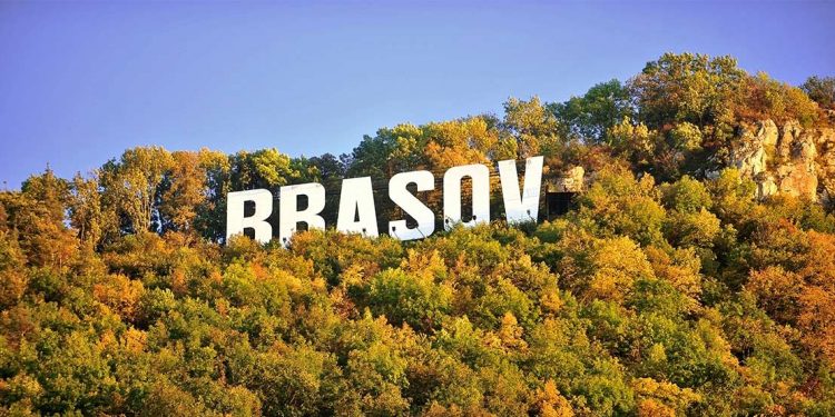 Brasov “Hollywood” Sign appears in trees during Autumn