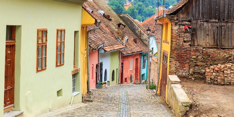 Colourfully painted village homes littered in Sighisoara, Romania