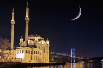 Crescent moon appears over a mosque in Istanbul, Turkey.
