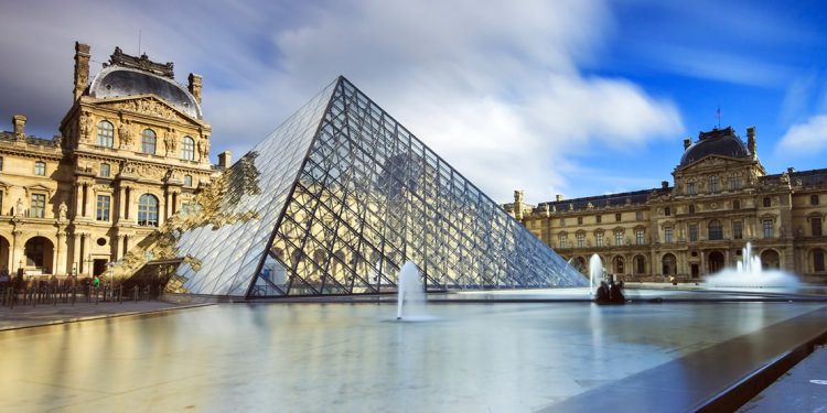 The glass pyramid and fountains outside The Louvre
