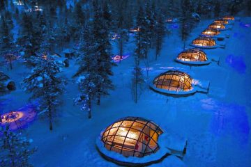 glass igloo style hotel rooms in snow