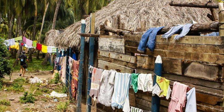 hut with clothes drying outside