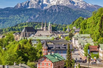 german village in front of mountains