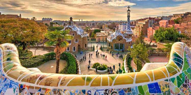 people walking through Guell Park in Barcelona