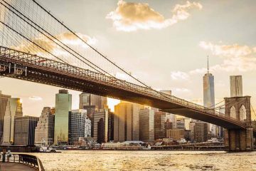 Brooklyn bridge and New York City skyline at sunset