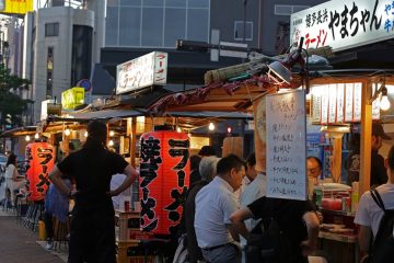 people eating at food stalls