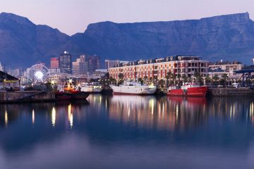 harborfront in cape town, south africa with mountains in the distance