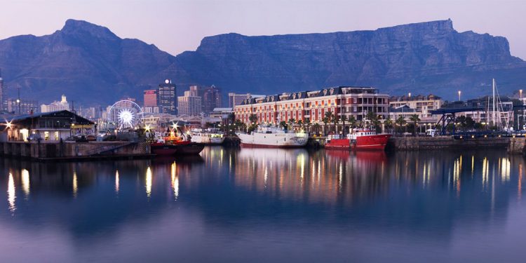harborfront in cape town, south africa with mountains in the distance
