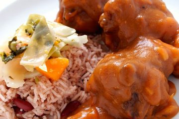 close up of sauced up oxtail and side of rice