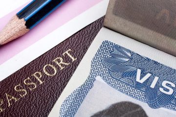 close up of passport and visa on a table