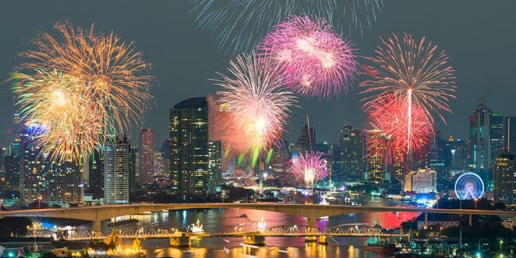fireworks display over bangkok skyline