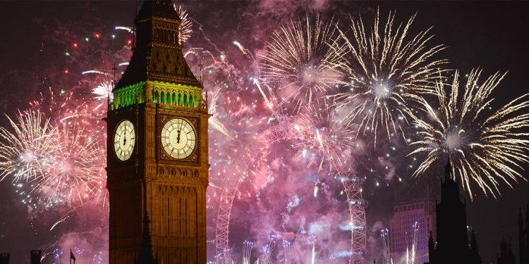 fireworks display behind big ben in london, england