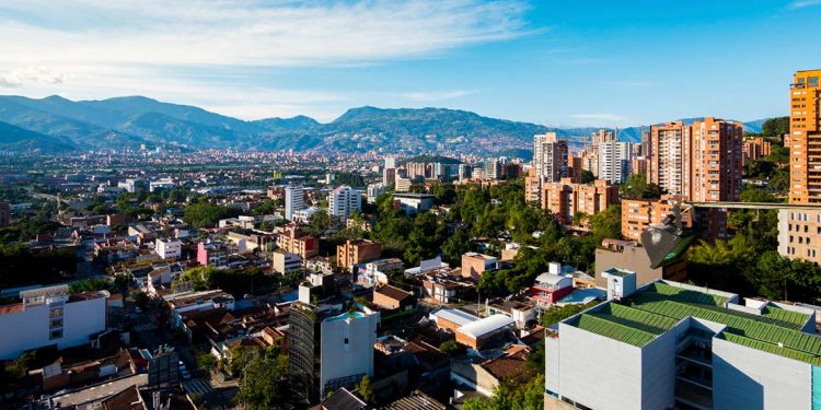 cityh of medellin, colombia with mountains in the background
