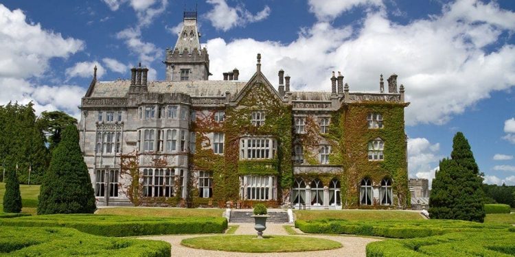 Exterior and grounds of the ivy-covered Adare Manor Hotel