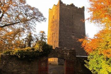 Tower at Ross Castle with fall trees in the foreground