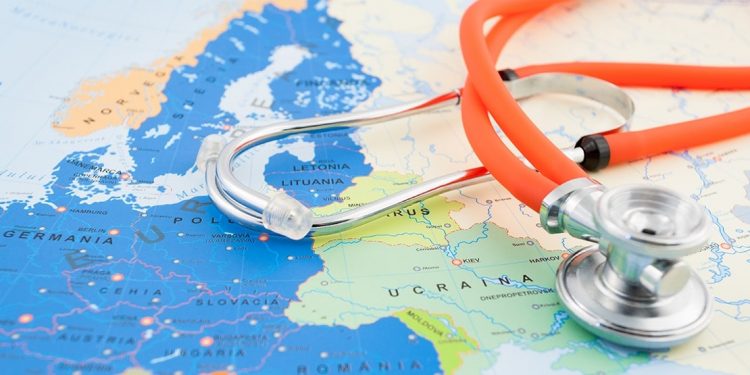 Stethoscope sits on top of a map of Europe