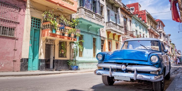 Blue classic car parked on a street in Havana