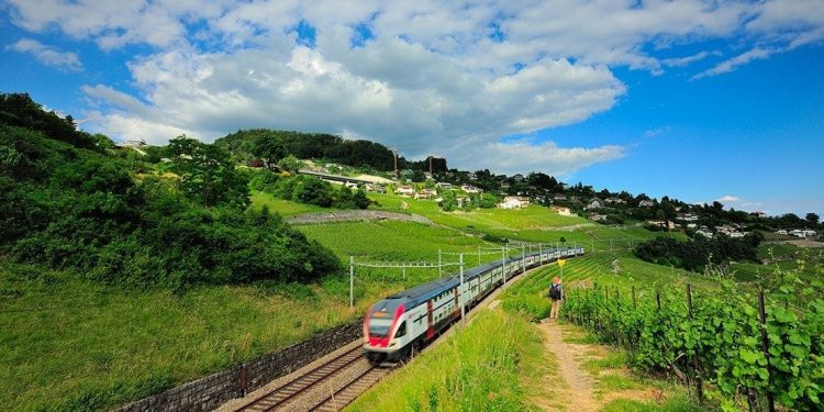 A train travels through the Swiss countryside