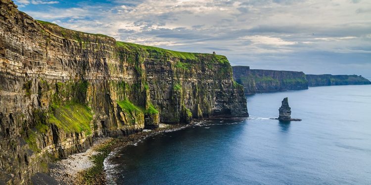 Cliffs drop off into the ocean along the coast in Ireland
