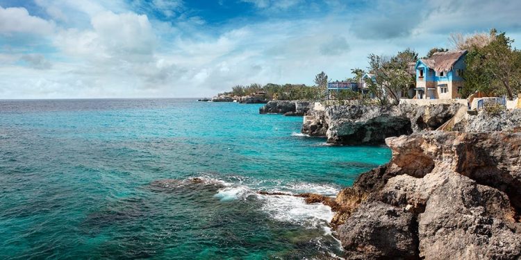cliffs overlooking turquoise water in negril, jamaica