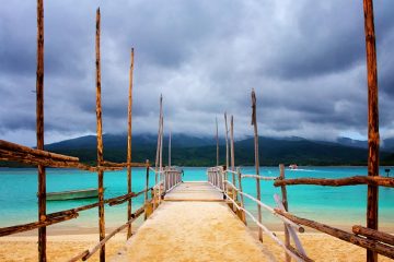 dock leading to turquoise waters