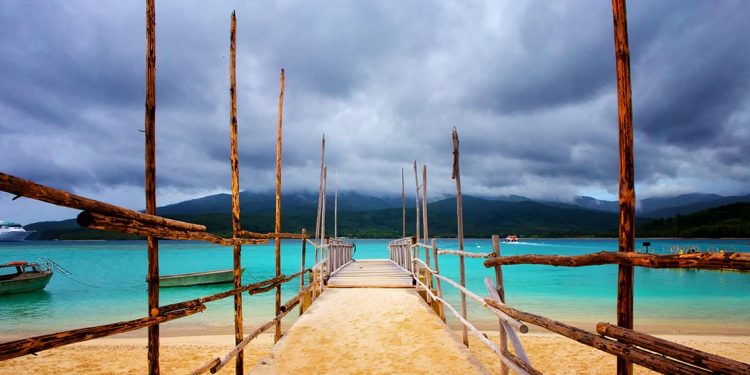 dock leading to turquoise waters