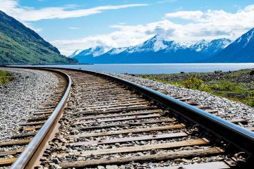 Train tracks with mountains in the background