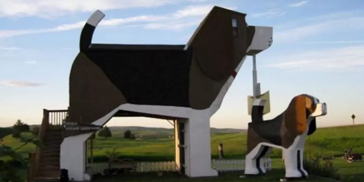 Two houses, one large and one small, are shaped like basset hounds
