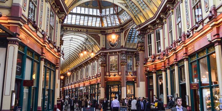 The inside of a London mall contains old architecture reminiscent of a traditional train station