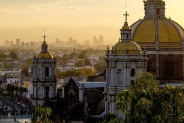 A Mexican cathedral overshadows the many buildings of Mexico City