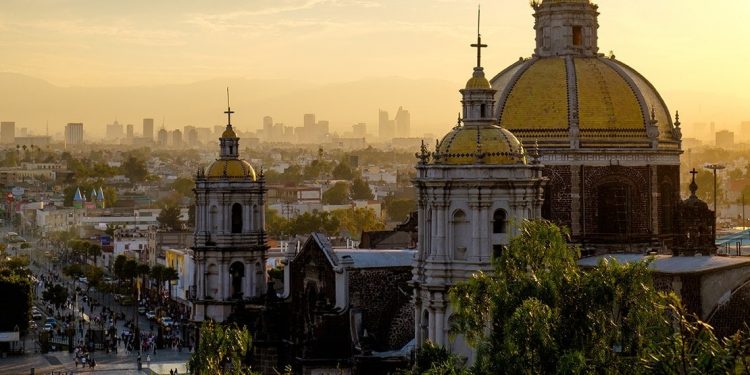 A Mexican cathedral overshadows the many buildings of Mexico City