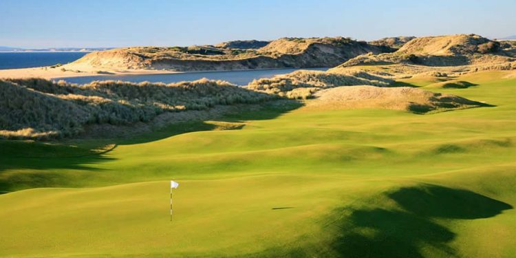 Sand dunes and views of the see the Barnbougle Dunes golf course includes many small hills on the green fairway