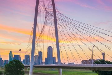 The Dallas bridge stands before the Texas city while the sun sets