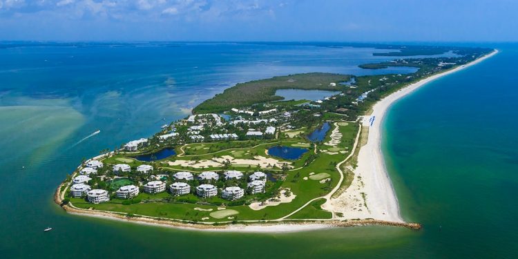 A private island includes numerous hotel buildings, golf courses, beaches, and plenty of nature