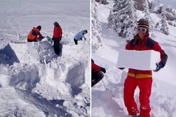 A family working together to build an igloo with snow bricks
