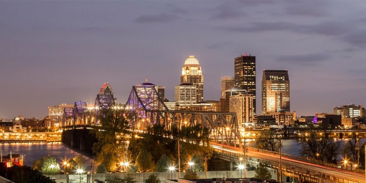 The city of Louisville, Kentucky lights up before night begins