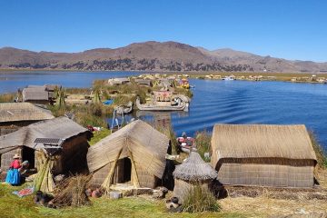 A small village continues its day-to-day living by the lake