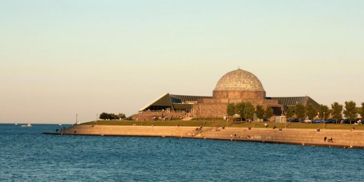 The dome shaped planetarium sits at the edge of Lake Michigan.