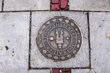 A bronze marker in the sidewalk along the Freedom Trail.