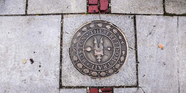 A bronze marker in the sidewalk along the Freedom Trail.