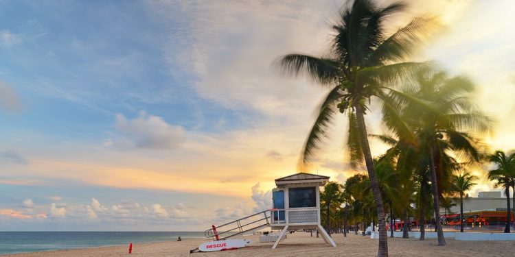 Sunset at Sunrise Beach in Ft. Lauderdale with palm trees and beach entry feature.