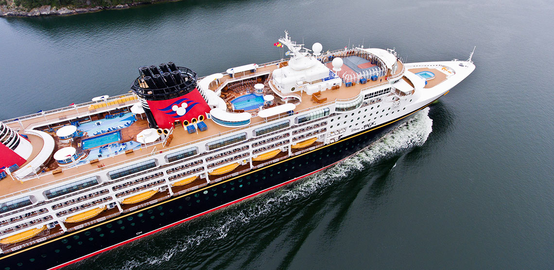 A view of a cruise ship from above with pools clearly visible on the top deck.