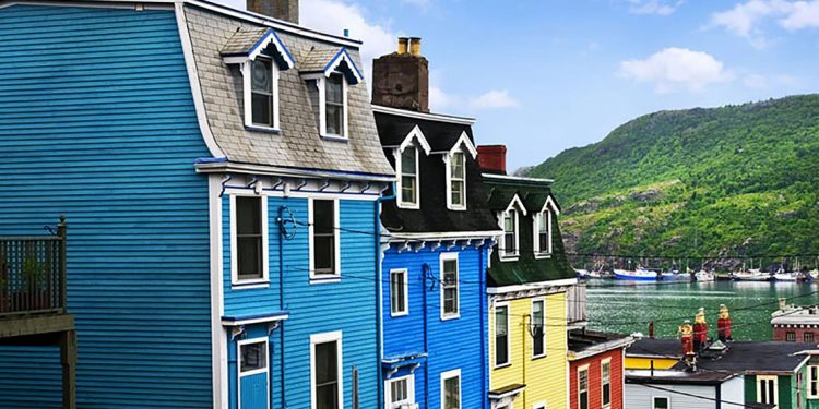 Colorful paneled houses along a street.