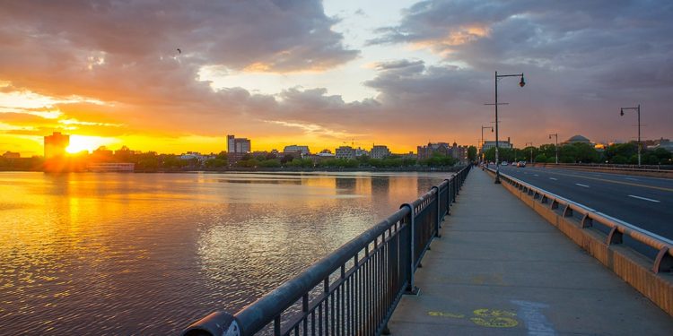 The sun setting over the Charles River, viewed from the Charles River Esplanade