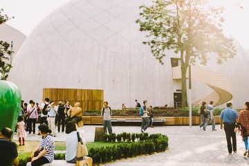 Outside the Space Museum, a white dome with people milling around the courtyard outside.