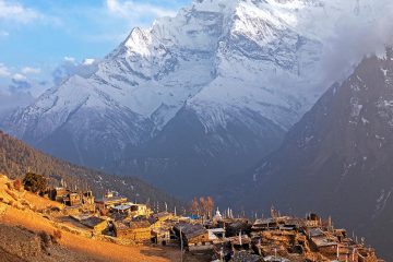 Small village of Nepal with Himalayas in the background